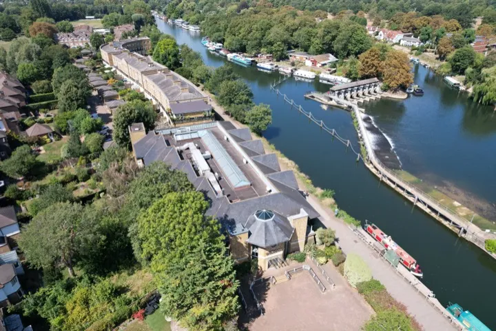 Wide aerial of property and river