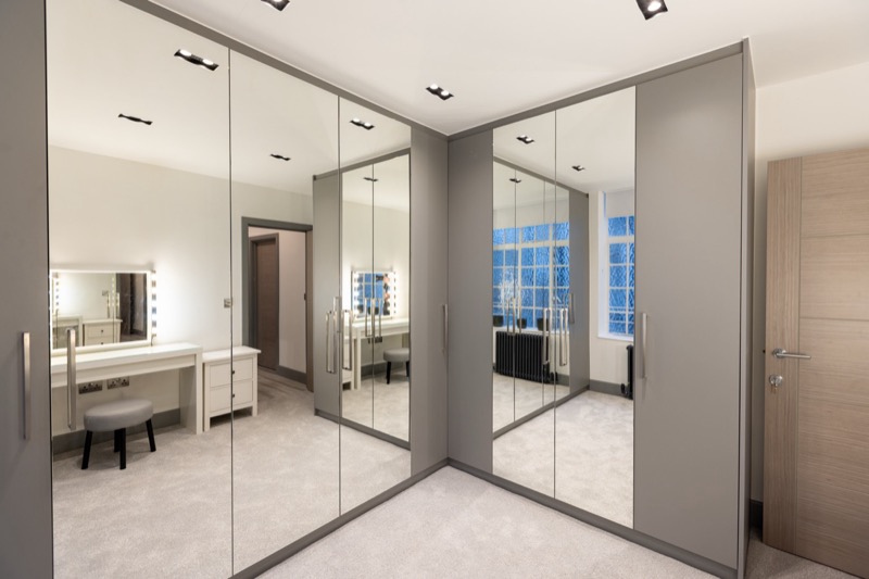 Elegant dressing room with mirrored storage
