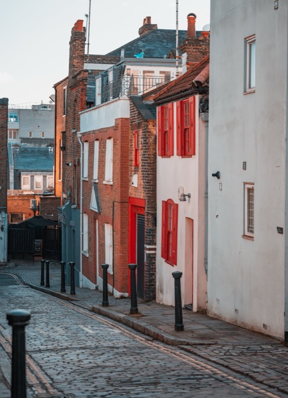 Cobbled mews street with colourful doors