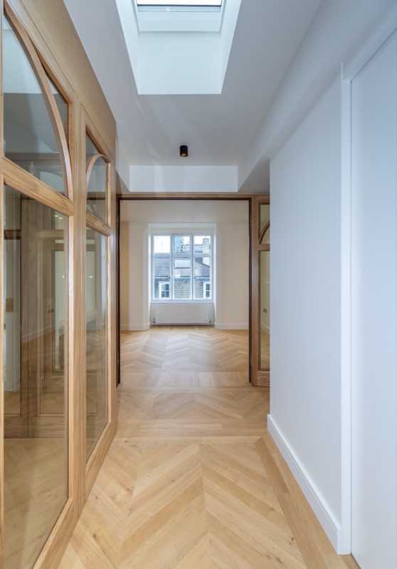Grand living room with marble flooring and statement art