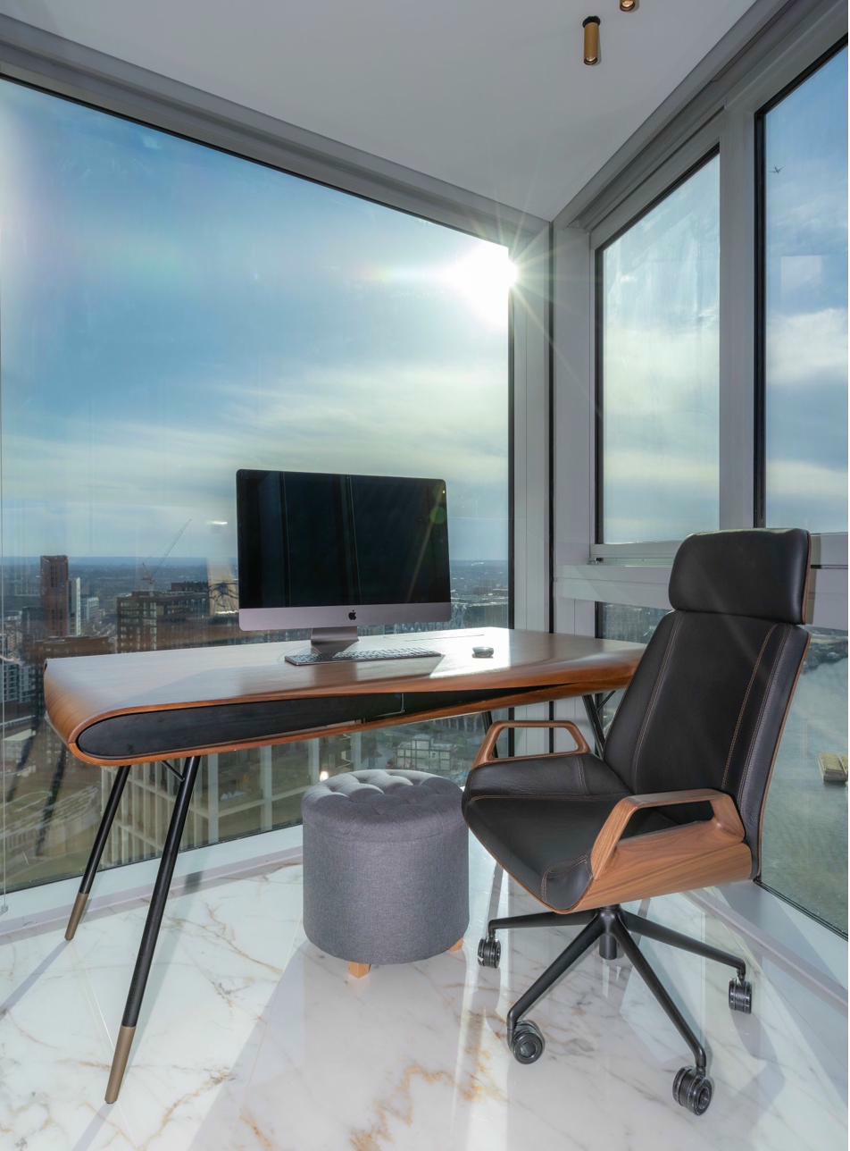 Home office with built-in desk and shelving
