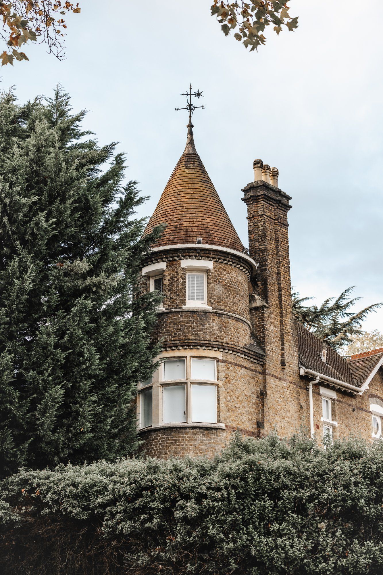 Victorian brick turret with weathervane