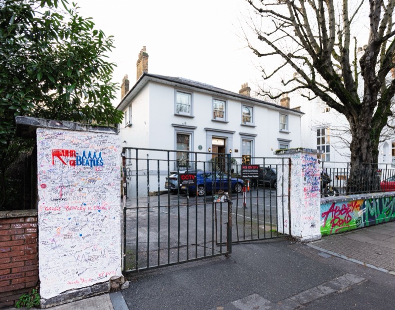 Abbey Road Studios with iconic graffiti-covered walls - the world-famous Beatles recording studio in St John's Wood
