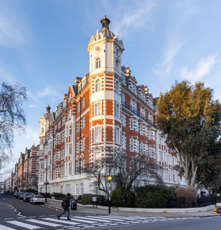 Corner tower building at golden hour in St John's Wood