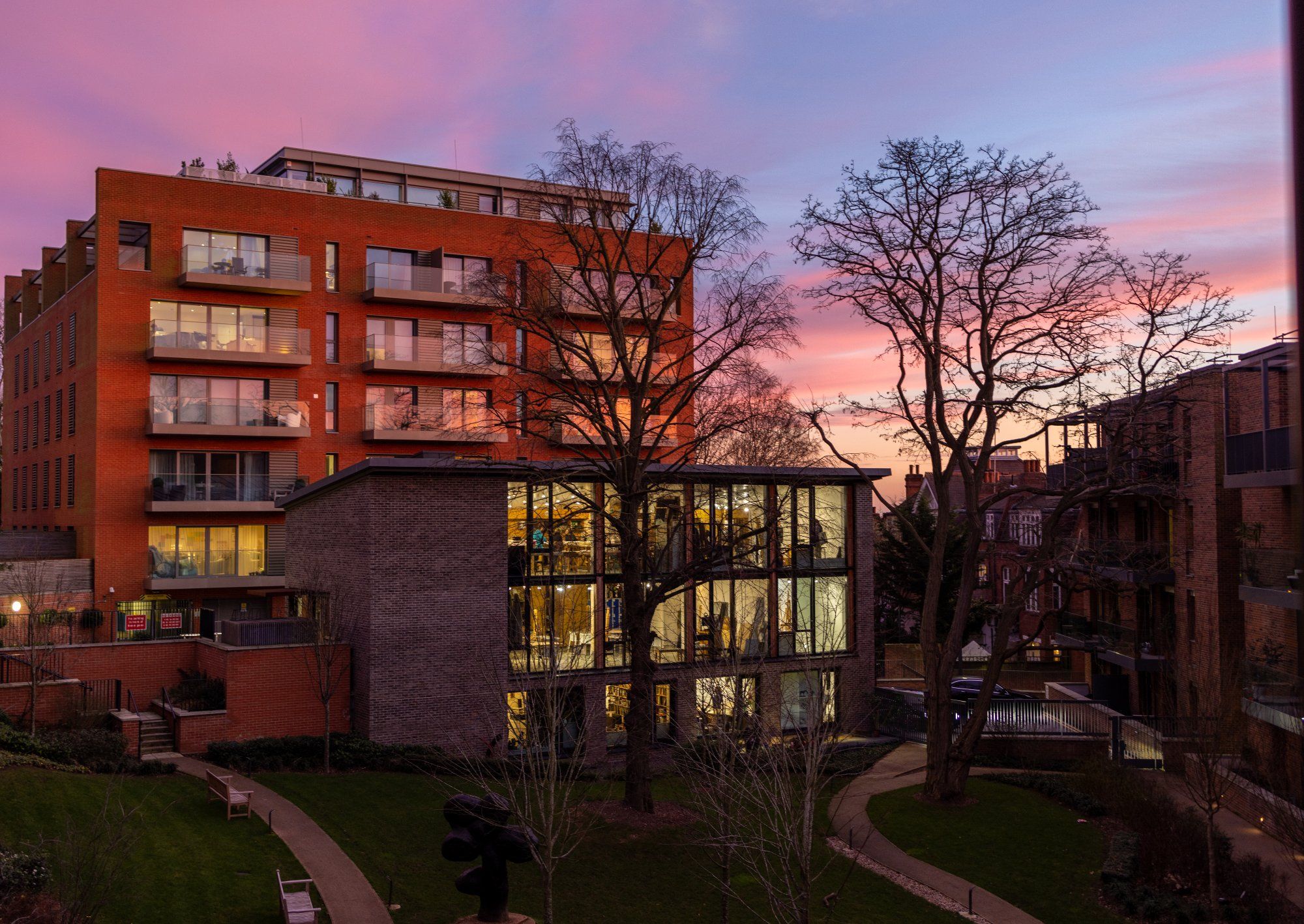 Stunning dusk shot of modern development with pink sky